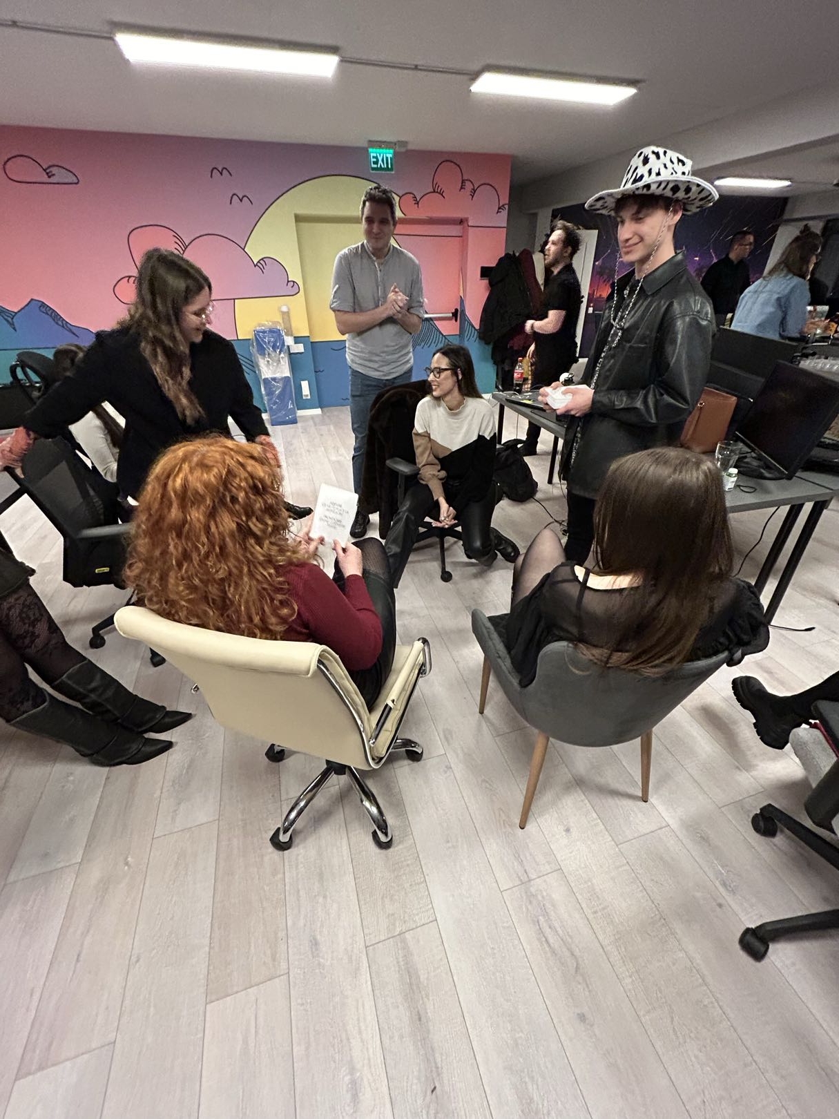 Improvised mismatched chairs in a circle - not enough seats for new hires